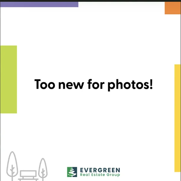 A white background with the text "Too new for photos!" and the Evergreen Real Estate Group logo at the bottom. Colored corners and park-like line drawings decorate the image.