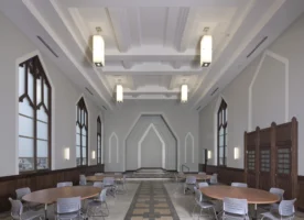 A spacious room with high ceilings, large windows, modern light fixtures, round tables with chairs, and a geometric patterned floor.