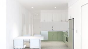 Minimalist kitchen with green lower cabinets, white upper cabinets, stainless steel appliances, a sink, and a dining table with four chairs. The space is brightly lit with recessed lighting.