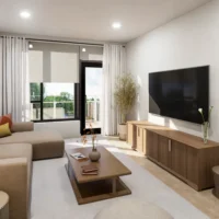 Modern living room with a large wall-mounted TV, wooden furniture, white curtains, beige sofa, coffee table with decor, and a balcony door letting in natural light.